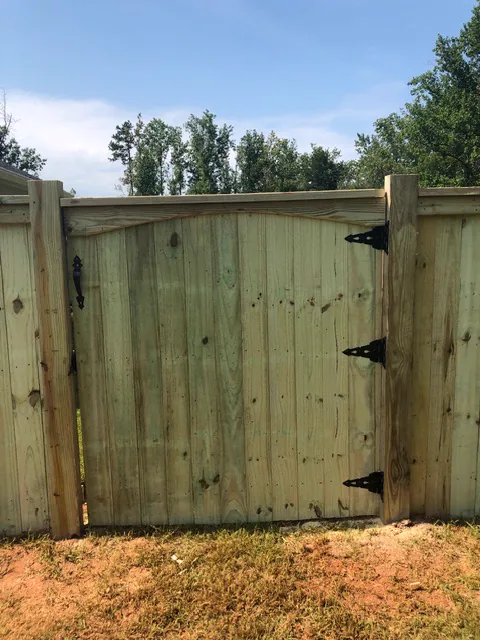 Custom arched wood gate and privacy fence built by CC Fencing in Upstate SC